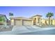 Desert home featuring a barrel tile roof, a three-car garage, and drought-tolerant landscaping at 1414 E Amberwood Dr, Phoenix, AZ 85048