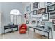 Bright home office features a piano, red leather armchair and wall decor at 1414 E Amberwood Dr, Phoenix, AZ 85048