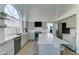 Well-lit kitchen with stainless steel appliances, a kitchen island and eat in bar seating at 1414 E Amberwood Dr, Phoenix, AZ 85048