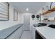 Well-organized laundry room with modern washer/dryer and plenty of storage at 1414 E Amberwood Dr, Phoenix, AZ 85048
