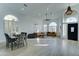 Open-concept living room showcasing wood-look floors, large windows, and a cozy seating area at 1414 E Amberwood Dr, Phoenix, AZ 85048