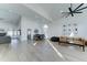 Bright, open-concept living space featuring wood-look floors, high ceilings, and plenty of natural light at 1414 E Amberwood Dr, Phoenix, AZ 85048