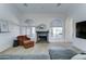 Inviting living room with cozy fireplace, comfortable seating, and arched windows for natural light at 1414 E Amberwood Dr, Phoenix, AZ 85048