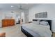 Spacious main bedroom featuring wood floors, ceiling fan, and a large walk-in closet at 1414 E Amberwood Dr, Phoenix, AZ 85048