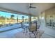 Covered outdoor patio with a seating area overlooking the pool and surrounding area at 1414 E Amberwood Dr, Phoenix, AZ 85048