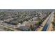 Aerial view of the property in its community, near a canal and surrounded by other homes at 14720 W Edgemont Ave, Goodyear, AZ 85395