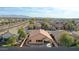 Aerial view of the home shows the covered patio and a view of the surrounding neighborhood at 14720 W Edgemont Ave, Goodyear, AZ 85395