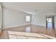 Bright and airy living room with wood-look flooring, neutral walls, and ample natural light at 14720 W Edgemont Ave, Goodyear, AZ 85395