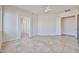 Large main bedroom with tile floors, ensuite bath, and walk-in closet at 14720 W Edgemont Ave, Goodyear, AZ 85395