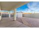 Backyard with a concrete patio, a storage shed, and a privacy wall at 1625 S 113Th Ave, Avondale, AZ 85323