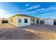 Backyard featuring a storage shed, a gravel area, and a stucco exterior at 1625 S 113Th Ave, Avondale, AZ 85323