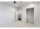 Bright bedroom featuring marble tile floors, two closets, and neutral walls at 1625 S 113Th Ave, Avondale, AZ 85323