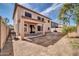 A spacious backyard featuring a covered patio and ample space for outdoor activities at 17388 W Elaine Dr, Goodyear, AZ 85338