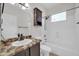 Cozy bathroom featuring tub shower combination and vanity with sink at 17388 W Elaine Dr, Goodyear, AZ 85338