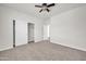 Spacious bedroom features a ceiling fan and large closet for ample storage at 17388 W Elaine Dr, Goodyear, AZ 85338