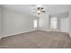 Spacious bonus room boasts neutral carpet, recessed lights and an airy feel at 17388 W Elaine Dr, Goodyear, AZ 85338