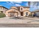 Charming two-story stucco home featuring a two-car garage and low maintenance landscaping at 17388 W Elaine Dr, Goodyear, AZ 85338