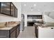 Bright kitchen with stainless steel appliances, center island, and tile floors at 17388 W Elaine Dr, Goodyear, AZ 85338