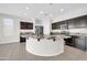 Spacious kitchen featuring large center island, stainless appliances, and tile floors at 17388 W Elaine Dr, Goodyear, AZ 85338