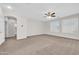 Spacious living room with neutral paint, carpeting, and lots of natural light at 17388 W Elaine Dr, Goodyear, AZ 85338