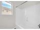 Bathroom shower featuring a showerhead and window at 17388 W Elaine Dr, Goodyear, AZ 85338