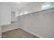 Walk-in closet with built-in shelving and ample storage at 17388 W Elaine Dr, Goodyear, AZ 85338