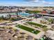 Aerial view of community pool, playground, and lawn game area at 174 S 177Th Ln, Goodyear, AZ 85338