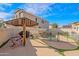Entertainer's backyard featuring a pool, covered patio, and lush landscaping at 17722 N 183Rd Ave, Surprise, AZ 85374