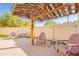 Enjoy this backyard patio featuring a pergola, string lights, and comfortable seating at 17722 N 183Rd Ave, Surprise, AZ 85374