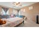 Comfortable bedroom with a ceiling fan and neutral decor, perfect for relaxation at 17722 N 183Rd Ave, Surprise, AZ 85374