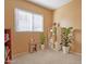 Bright bedroom featuring neutral walls, carpet flooring, and a large window with ample natural light at 17722 N 183Rd Ave, Surprise, AZ 85374
