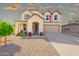 Charming two-story home featuring a well-manicured front yard and traditional design elements at 17722 N 183Rd Ave, Surprise, AZ 85374