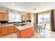 Bright kitchen with stainless steel appliances, a center island, and a breakfast nook area at 17722 N 183Rd Ave, Surprise, AZ 85374