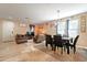 Inviting open-concept living room and dining area with tile flooring and neutral walls at 17722 N 183Rd Ave, Surprise, AZ 85374