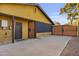 Spacious driveway with secure gated access, leading to a convenient side entry at 1807 E Medlock Dr, Phoenix, AZ 85016