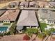 Bird's eye view of home and backyard with pool, grassy area, and desert landscaping at 18207 W Hope Dr, Goodyear, AZ 85338