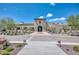 Grand clubhouse featuring a stone facade, well-manicured landscaping, and inviting entrance, perfect for community gatherings at 18207 W Hope Dr, Goodyear, AZ 85338