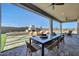 Inviting outdoor living space featuring a dining area, fireplace, and manicured landscaping perfect for entertaining at 18429 W Mohave St, Goodyear, AZ 85338