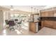 Bright kitchen featuring ample cabinet space, modern appliances, and a view of the patio at 18630 N Palo Verde Dr, Sun City, AZ 85373