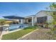 Beautiful backyard featuring a refreshing pool, lush green lawn, and an outdoor dining area at 19140 N 259Th Ave, Buckeye, AZ 85396