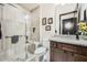 Modern bathroom showcasing a glass-enclosed shower, sleek fixtures, and a vanity with granite countertops at 19140 N 259Th Ave, Buckeye, AZ 85396