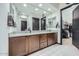 Stylish bathroom with granite countertops, wood cabinets, dual sinks, and a walk-in closet at 19140 N 259Th Ave, Buckeye, AZ 85396