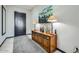 Inviting entryway featuring a stylish wooden console table, decorative lamps, and an elegant painting at 19140 N 259Th Ave, Buckeye, AZ 85396