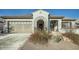 Charming single-story home with a well-manicured front yard and a convenient two-car garage at 19140 N 259Th Ave, Buckeye, AZ 85396