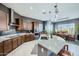 Modern kitchen with granite countertops, stainless steel appliances, and a spacious center island at 19140 N 259Th Ave, Buckeye, AZ 85396