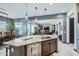 Open-concept kitchen with island and a view into the living room at 19140 N 259Th Ave, Buckeye, AZ 85396