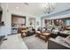 Spacious living room featuring comfortable leather seating, a wet bar area, and stylish decor at 19140 N 259Th Ave, Buckeye, AZ 85396