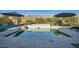Sparkling pool with integrated water feature, complemented by lush landscaping at 19140 N 259Th Ave, Buckeye, AZ 85396