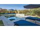 Relaxing poolside view with lounge chairs and verdant landscaping at 19140 N 259Th Ave, Buckeye, AZ 85396