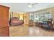 Large main bedroom with bay windows, hardwood floors, and a four-poster bed at 19701 N Hidden Ridge Dr, Surprise, AZ 85374